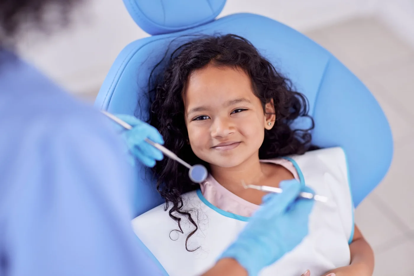Smiling girl during a dental checkup